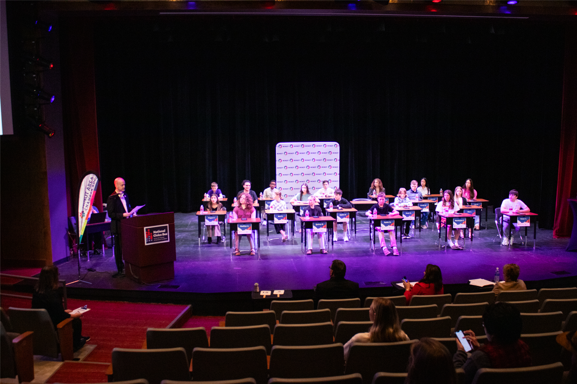 Students in desks participating in a competition