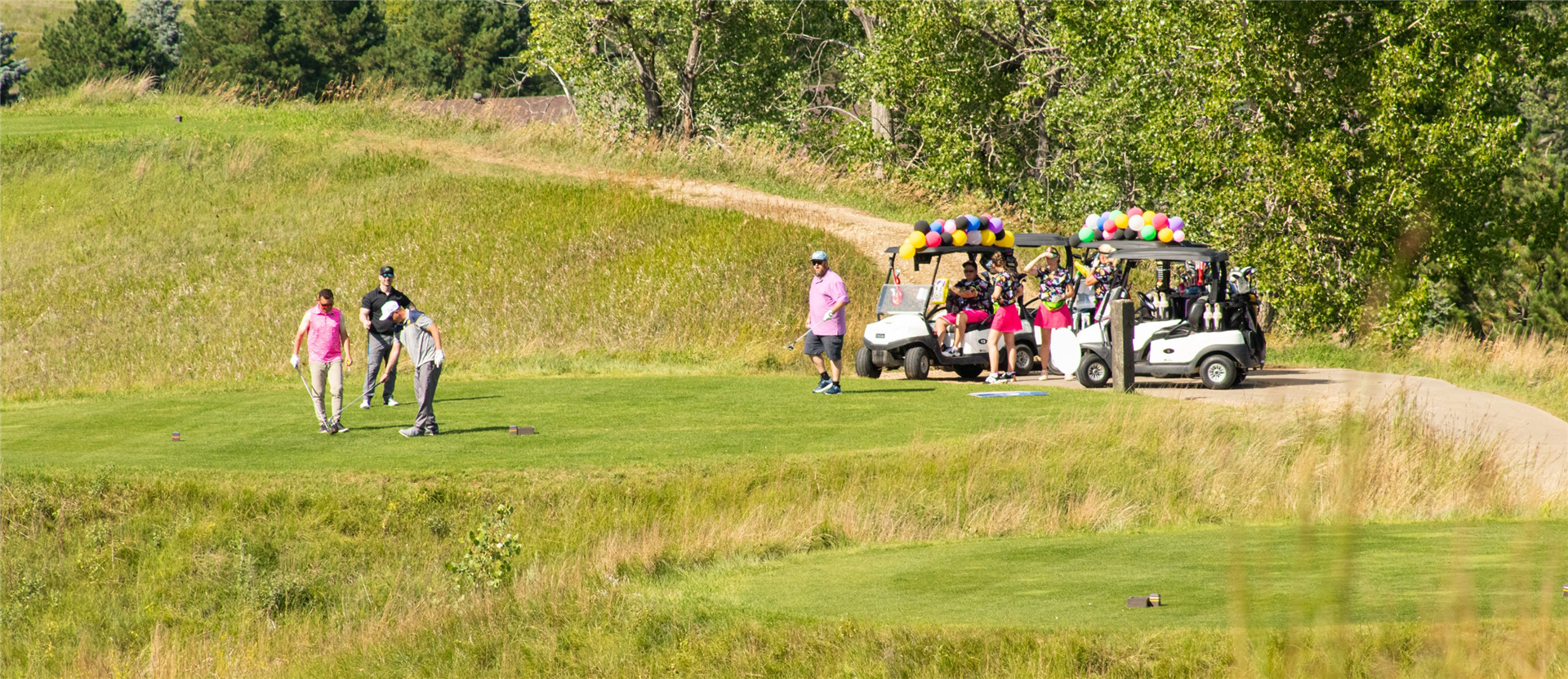 Photo of golfers on a golf course