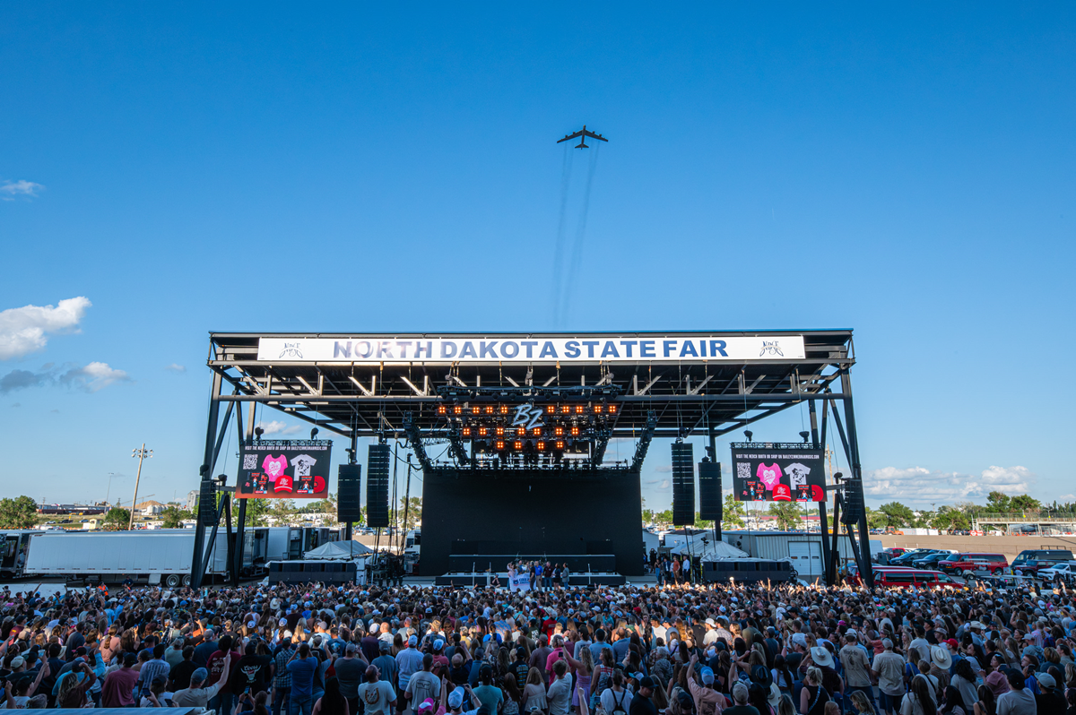 A B-52 Stratofortress Flies over the North Dakota State Fair Grandstand as Minot was recognized as a 2025 Great American Defense Community on Friday, July 18. 