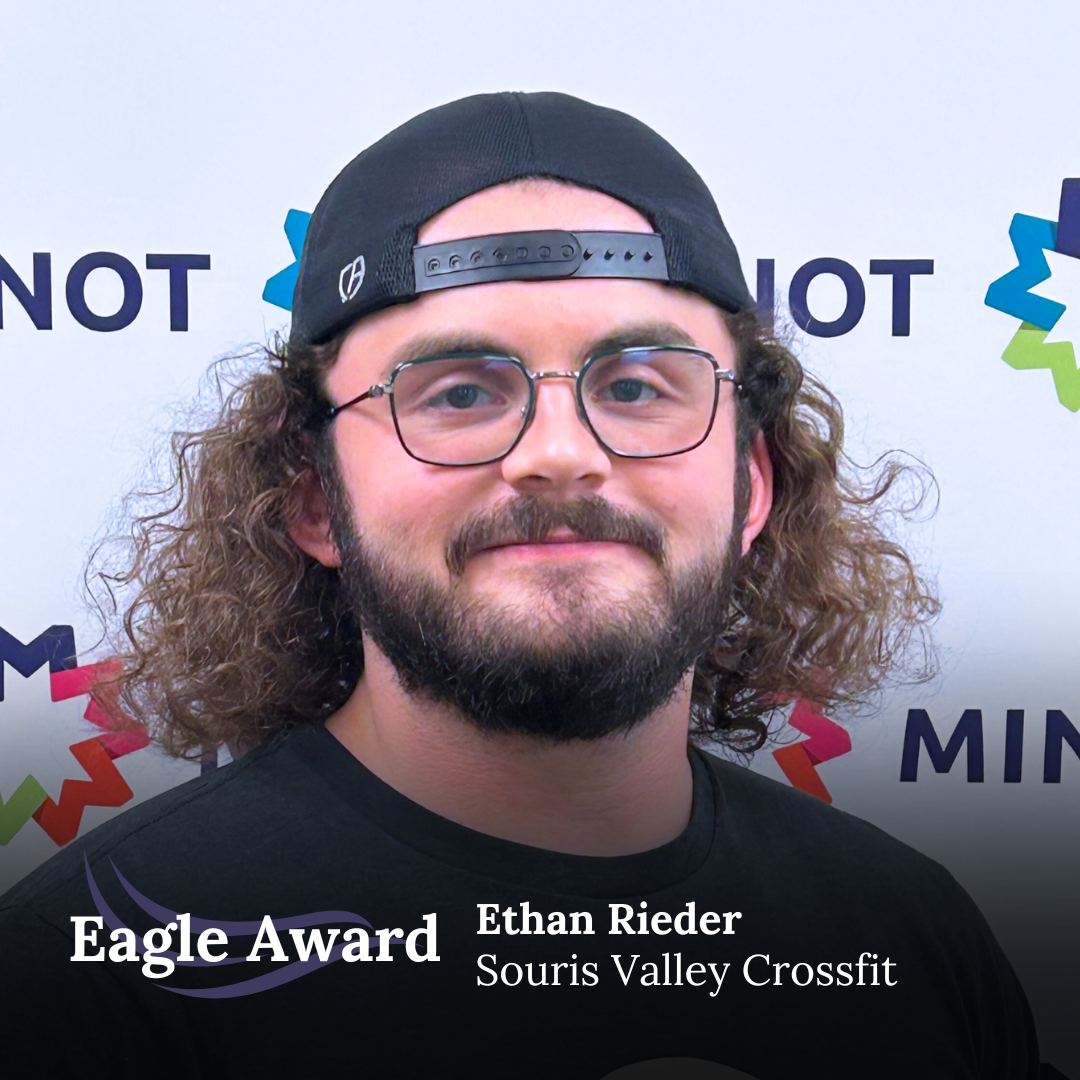 “It’s hard to single out just one instance where Ethan has gone out of his way to help me, but the first thing that comes to mind is when I first started attending CrossFit. Ethan recognized one of my biggest weaknesses (shoulder mobility) and offered to work with me before classes to improve it. He gave me some constructive feedback and ideas to try at home as well. It seemed innocuous at the time, but it greatly enhanced my ability to perform at a higher level and achieve better results. There are quite a few other examples I could list as well but the one thing I appreciate more than anything is Ethan’s consistency and contagious positivity. He’s always so optimistic. It makes coming to classes fun and enjoyable. I’ve been attending classes at Souris Valley CrossFit for 1 year. In that time I’ve lost 35 lbs of fat and gained 8.5 lbs of muscle – results I never thought would be possible at 44 years old. Ethan’s influence on my progress has been instrumental. I’m just one of many people in our community that have been positively influenced by Ethan’s dedication and consistent hard work. I can’t say enough great things about him.”